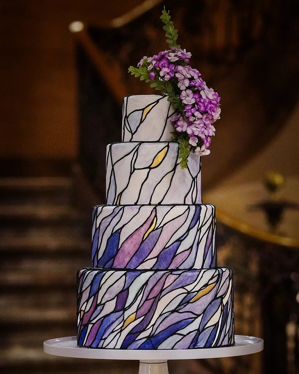 We just had to feature this stunning and regal cake for #NationalCakeDay 💜

Recently engaged? We'd love to create a dazzling work of art for your day.